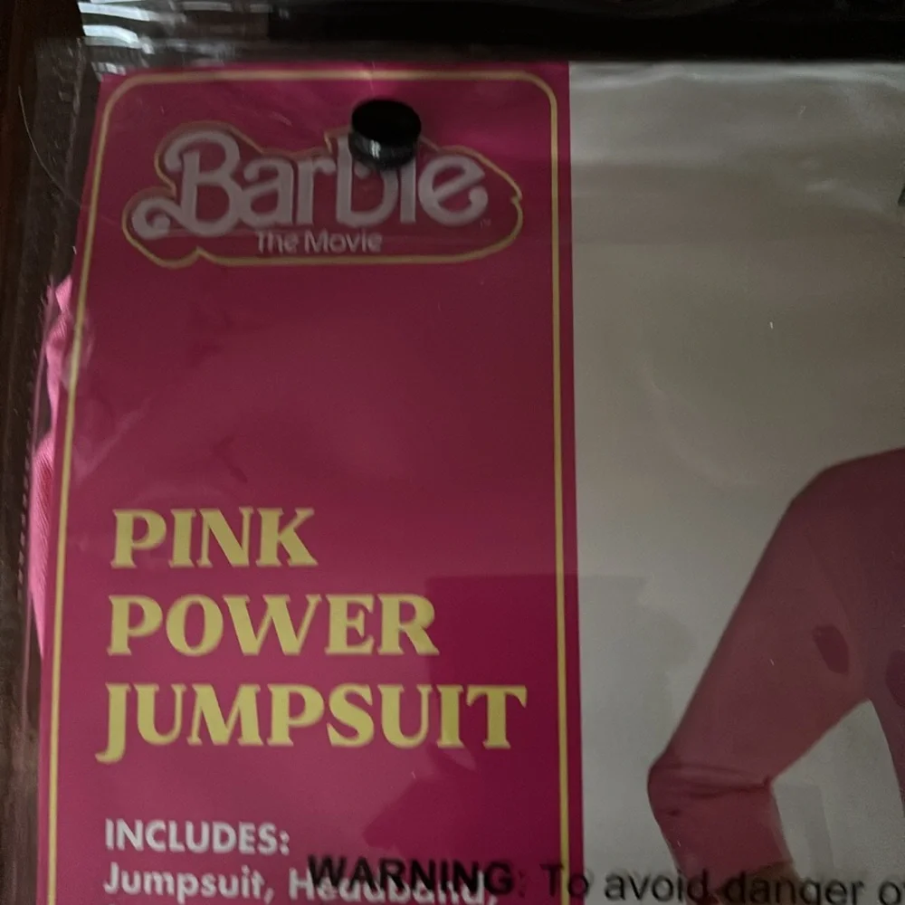 NWT  Spirit Halloween Barbie the Movie Kids Pink Power Jumpsuit size large 12-13